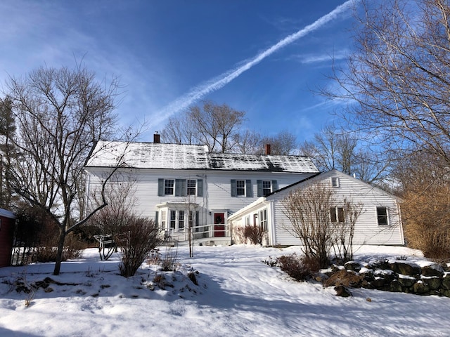 view of snow covered house