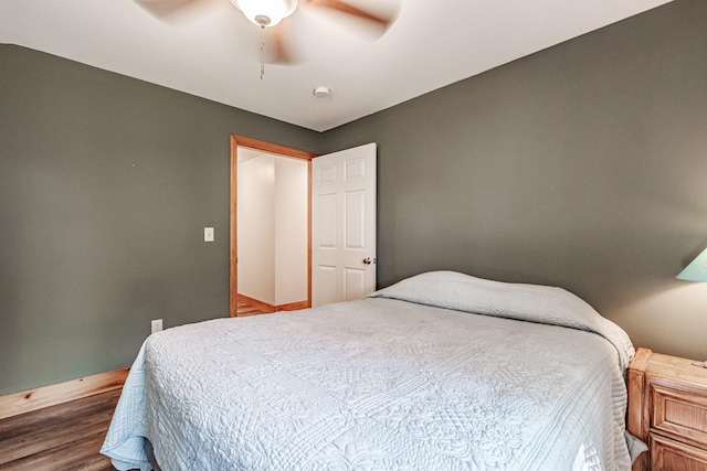 bedroom with wood-type flooring and ceiling fan