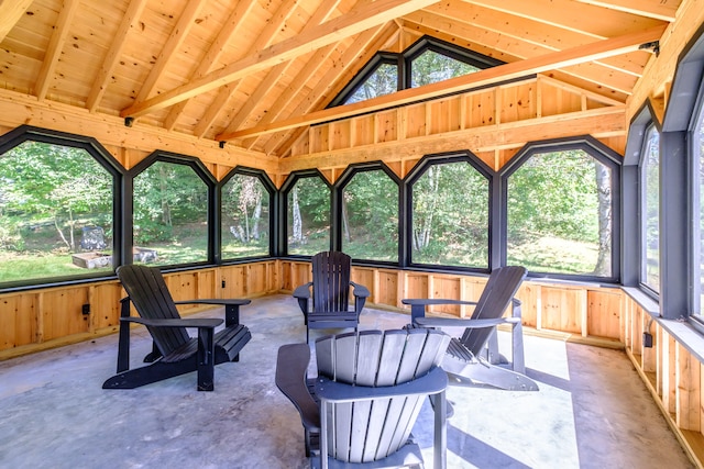 sunroom / solarium with vaulted ceiling with beams and wooden ceiling