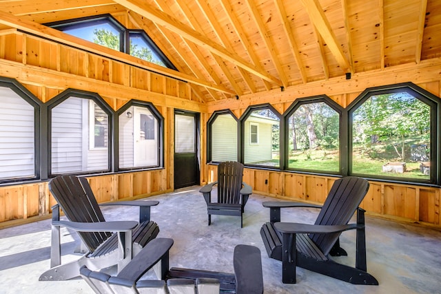 sunroom / solarium with wood ceiling, vaulted ceiling with beams, and a healthy amount of sunlight