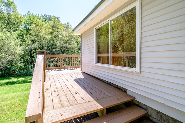 wooden terrace with a yard