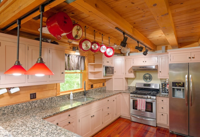 kitchen with pendant lighting, beamed ceiling, white cabinetry, appliances with stainless steel finishes, and dark hardwood / wood-style floors