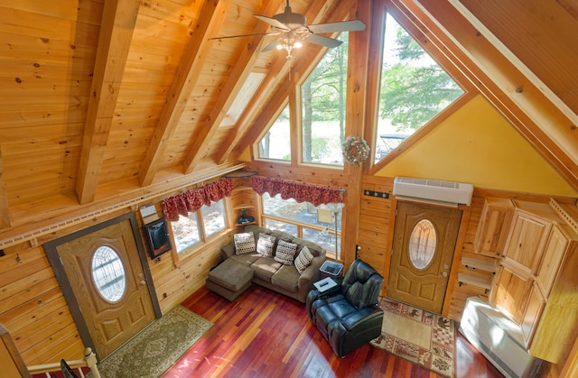 living room with wood ceiling, lofted ceiling with beams, hardwood / wood-style flooring, an AC wall unit, and ceiling fan