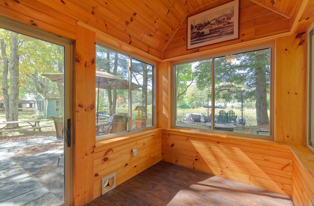 sunroom with a wealth of natural light, vaulted ceiling, and wooden ceiling