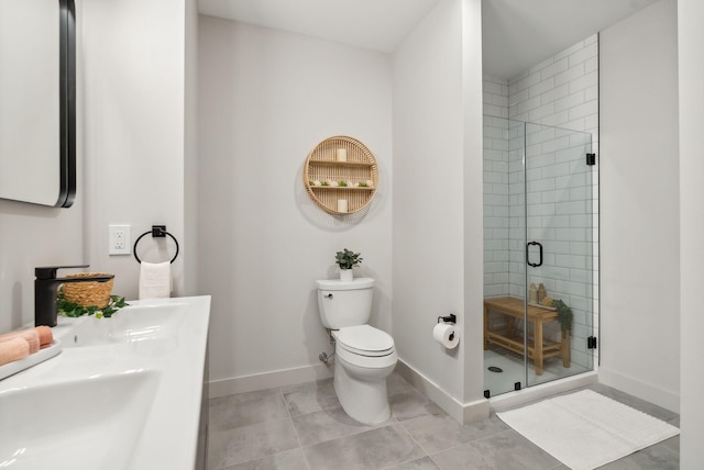 full bath with baseboards, toilet, tile patterned flooring, and a shower stall