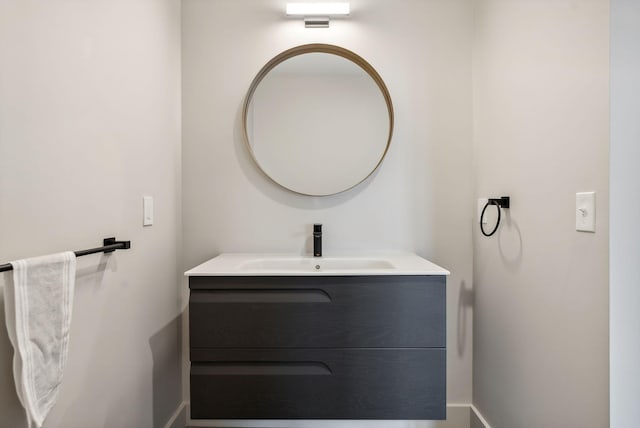 bathroom with baseboards and vanity