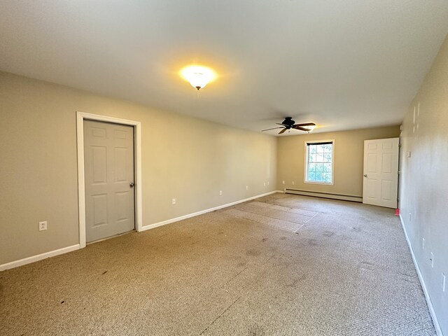 unfurnished room featuring ceiling fan, carpet floors, and baseboard heating