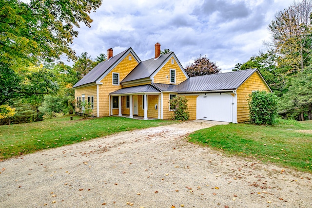 view of front facade featuring a front lawn and a garage