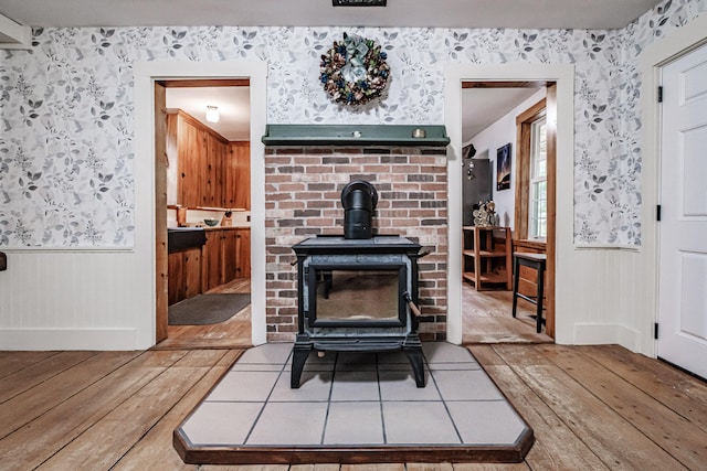 living room featuring hardwood / wood-style floors and a wood stove