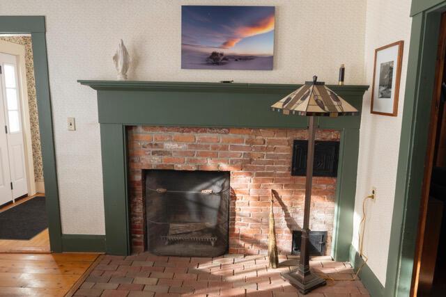 details with a fireplace and hardwood / wood-style floors