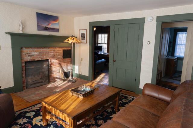 living room featuring hardwood / wood-style floors and a fireplace