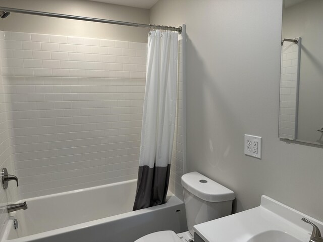 full bathroom featuring shower / bath combination with curtain, vanity, and toilet