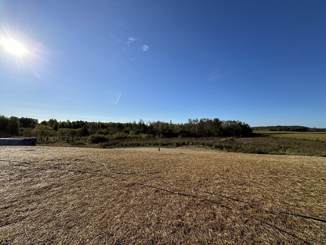 view of yard with a rural view