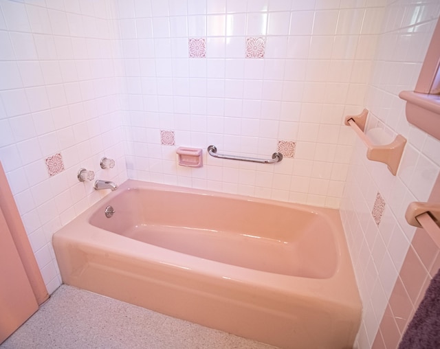 35 Middle Rd, Acton, ME 04001 - bathroom with a bathtub, tile walls, and speckled floor