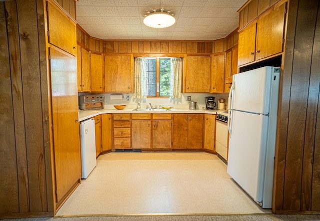 35 Middle Rd, Acton, ME 04001 - kitchen featuring white appliances, brown cabinets, light countertops, a sink, and light flooring