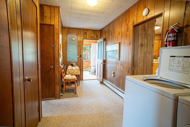 35 Middle Rd, Acton, ME 04001 - laundry area with a baseboard radiator, wood walls, independent washer and dryer, and light colored carpet