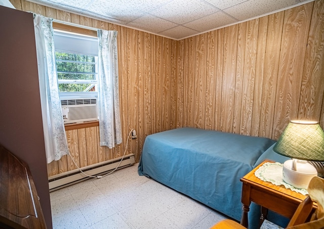 35 Middle Rd, Acton, ME 04001 - bedroom featuring a baseboard radiator, tile patterned floors, wooden walls, and cooling unit