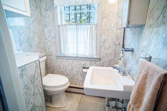35 Middle Rd, Acton, ME 04001 - bathroom with baseboard heating, toilet, and a sink