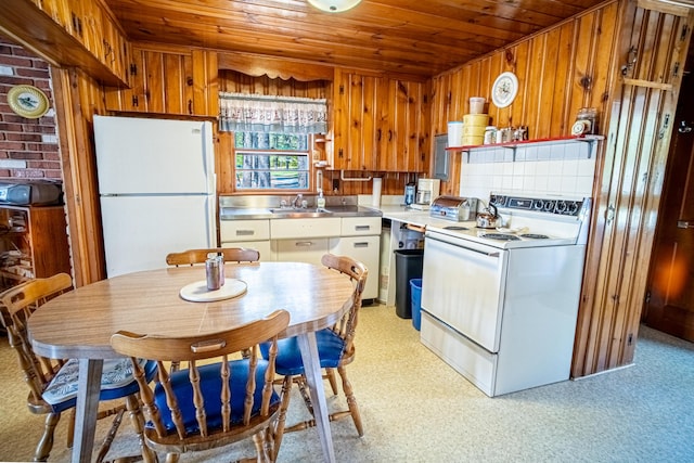 35 Middle Rd, Acton, ME 04001 - kitchen featuring stainless steel counters, white appliances, wooden ceiling, a sink, and wooden walls