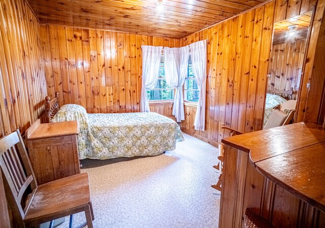 35 Middle Rd, Acton, ME 04001 - bedroom with wooden ceiling, wood walls, and carpet