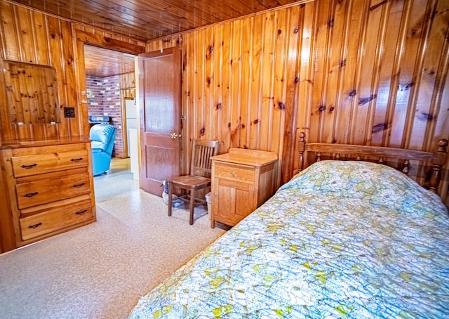 35 Middle Rd, Acton, ME 04001 - bedroom with wood ceiling, wood walls, and carpet flooring