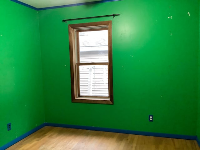 unfurnished room featuring wood-type flooring