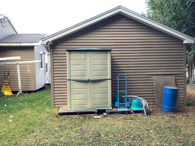 view of outdoor structure featuring a lawn