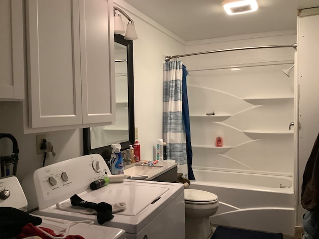 full bathroom with washer and dryer, vanity, toilet, and shower / bath combination with curtain