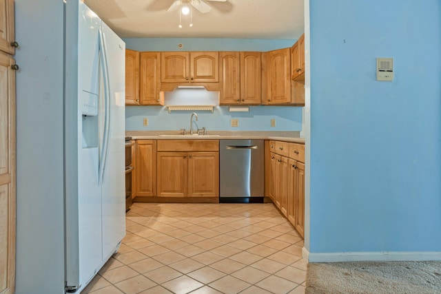215 E Grand Ave Unit 206, Old Orchard Beach, ME 04064 - kitchen with stainless steel appliances, a sink, a ceiling fan, and light countertops