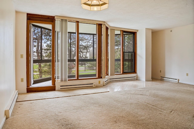 215 E Grand Ave Unit 206, Old Orchard Beach, ME 04064 - entryway with a baseboard radiator, baseboard heating, carpet, and a textured ceiling