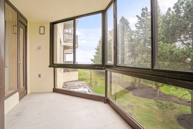 215 E Grand Ave Unit 206, Old Orchard Beach, ME 04064 - unfurnished sunroom featuring floor to ceiling windows