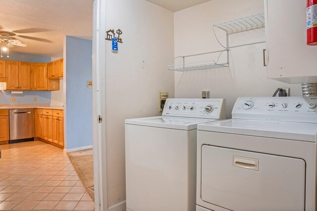 215 E Grand Ave Unit 206, Old Orchard Beach, ME 04064 - laundry area featuring washing machine and clothes dryer, ceiling fan, light tile patterned floors, and baseboards