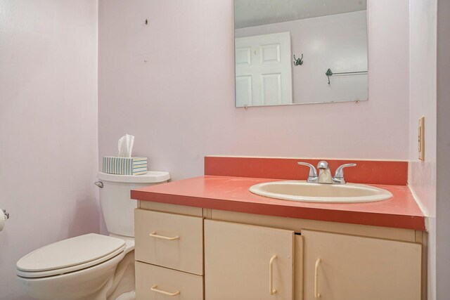 215 E Grand Ave Unit 206, Old Orchard Beach, ME 04064 - half bathroom featuring toilet and vanity