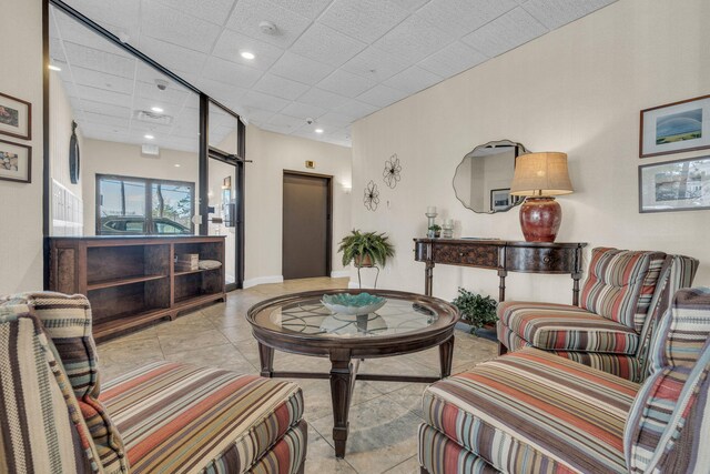 215 E Grand Ave Unit 206, Old Orchard Beach, ME 04064 - living area with tile patterned flooring, recessed lighting, and a paneled ceiling