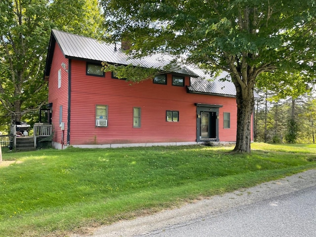 exterior space with a lawn and cooling unit