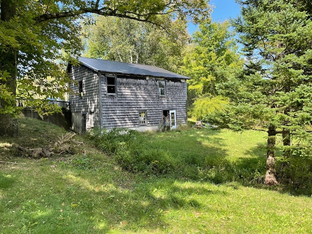 exterior space with a yard and an outbuilding