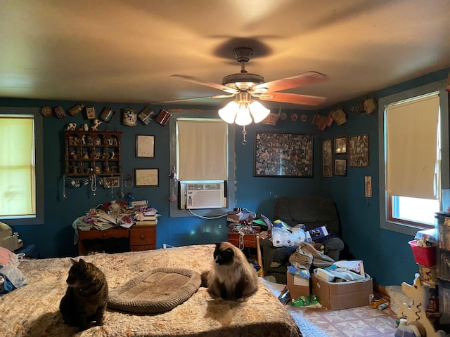 bedroom featuring cooling unit and ceiling fan