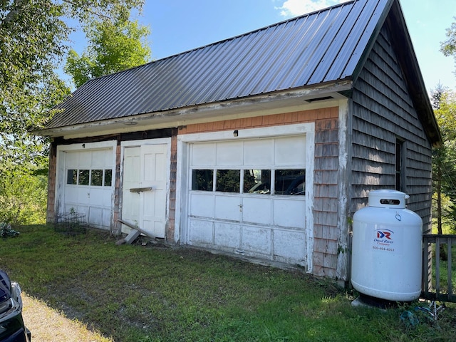 garage featuring a yard