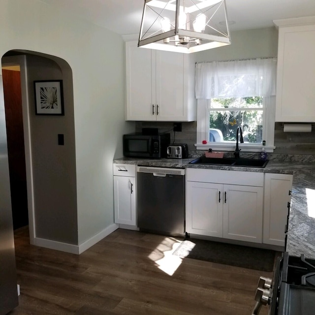 kitchen with white cabinets, dark hardwood / wood-style flooring, stainless steel dishwasher, sink, and a notable chandelier