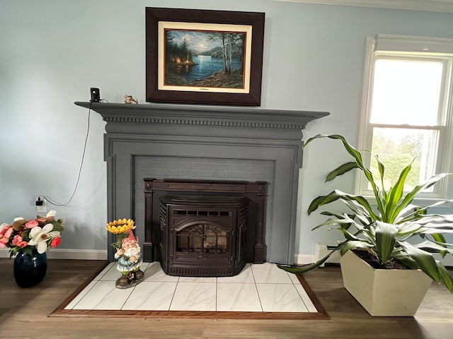 interior details featuring hardwood / wood-style flooring and baseboard heating