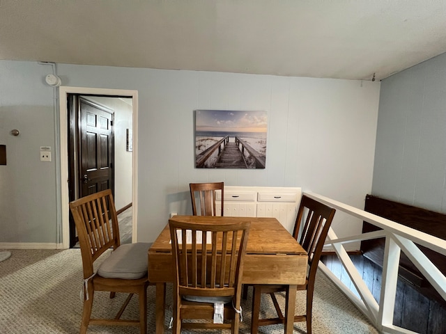 view of carpeted dining area