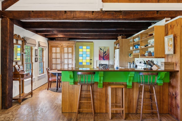 kitchen with beam ceiling and white fridge