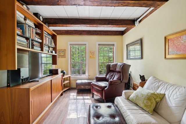 office space with beam ceiling and light hardwood / wood-style flooring