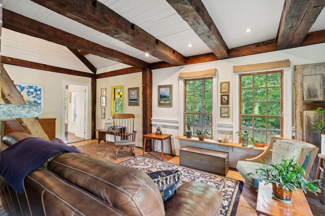 living room featuring light wood-type flooring and lofted ceiling with beams