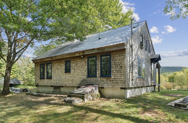 rear view of house with a yard