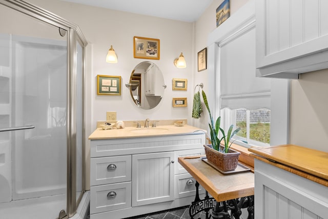 bathroom with walk in shower and vanity