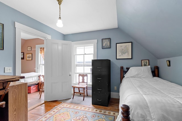 bedroom featuring vaulted ceiling