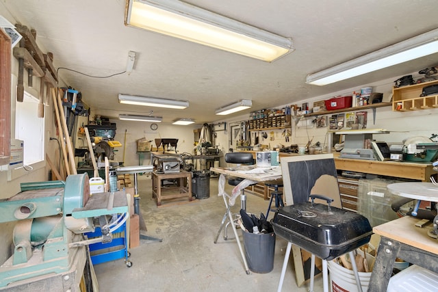 miscellaneous room featuring a workshop area