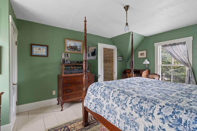 tiled bedroom with vaulted ceiling