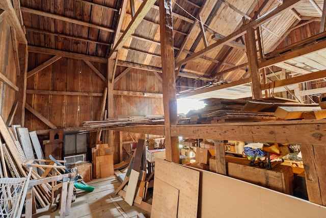 miscellaneous room featuring light wood-type flooring, wood walls, vaulted ceiling, and wooden ceiling